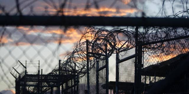 Nov. 21, 2013: Dawn arrives at the now closed Camp X-Ray, which was used as the first detention facility for Al Qaeda and Taliban militants who were captured after the Sept. 11 attacks, at the Guantanamo Bay Naval Base, Cuba. (AP Photo/Charles Dharapak, File)
