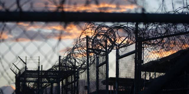 Nov. 21, 2013: Dawn arrives at the now closed Camp X-Ray, which was used as the first detention facility for Al Qaeda and Taliban militants who were captured after the Sept. 11 attacks, at the Guantanamo Bay Naval Base, Cuba. (AP Photo/Charles Dharapak, File)