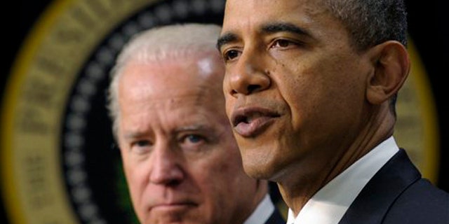 FILE - In a Feb. 21, 2012 file photo President Barack Obama, accompanied by Vice President Joe Biden, speaks in the Eisenhower Executive Office Building on the White House complex in Washington. A previously undisclosed Biden memo to Obama in November 2009 reflects his view that military commanders were asking Obama to take a leap by adding tens of thousands of forces in Afghanistan whose role was poorly defined. (AP Photo/Susan Walsh/file)