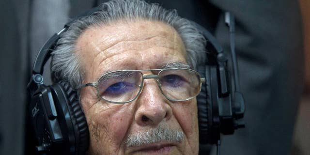 FILE - In this May 10, 2013 file photo, Guatemala's former dictator Jose Efrain Rios Montt wears headphones as he listens to the verdict in his genocide trial in Guatemala City. In an expert opinion dated July 1, 2015 and sent to the judge overseeing the first stage of Rios Montt’s case, the 89-year-old was determined by Guatemala’s National Institute of Forensic Sciences to be incapable of understanding the charges against him and of participating in his own defense. Prosecutors say Rios Montt is responsible for the deaths of almost 2,000 Mayan Indians, killed by the army between 1982 and 1983. (AP Photo/Moises Castilo, File)