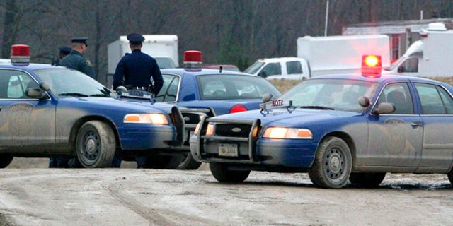 Mar. 28: Michigan State Police guard a home in Clayton after the FBI raided the home of a suspected militia leader.