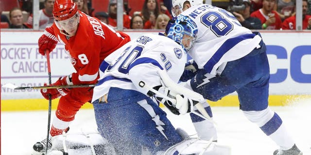 Tampa Bay Lightning goalie Ben Bishop (30) stops a Detroit Red Wings left wing Justin Abdelkader (8) shot in the second period of an NHL hockey game Tuesday, Nov. 15, 2016 in Detroit. (AP Photo/Paul Sancya)