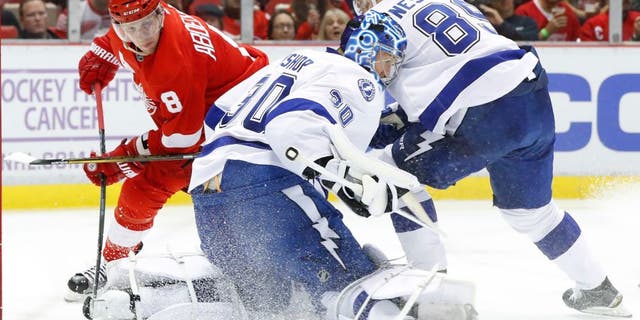 Tampa Bay Lightning goalie Ben Bishop (30) stops a Detroit Red Wings left wing Justin Abdelkader (8) shot in the second period of an NHL hockey game Tuesday, Nov. 15, 2016 in Detroit. (AP Photo/Paul Sancya)