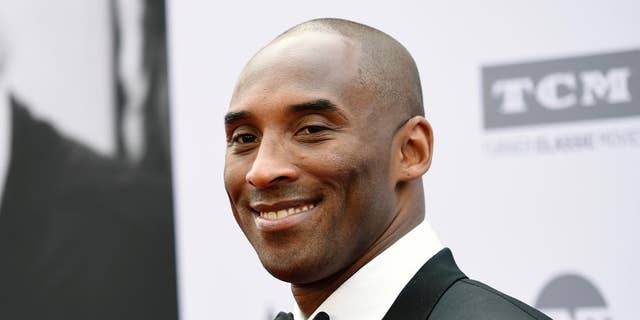 In this June 9, 2016 file photo, retired NBA basketball player Kobe Bryant poses at the 2016 AFI Life Achievement Award Gala Tribute to John Williams in Los Angeles.