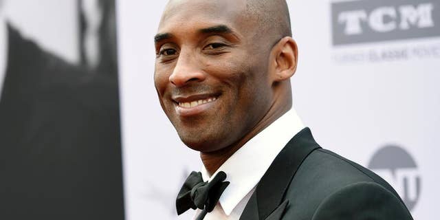In this June 9, 2016 file photo, retired NBA basketball player Kobe Bryant poses at the 2016 AFI Life Achievement Award Gala Tribute to John Williams in Los Angeles.