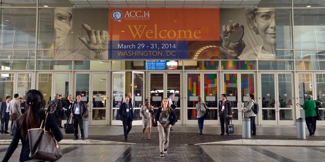 In this March 29, 2014, file photo, people attend the American College of Cardiology's Annual Scientific Session and Expo in Washington. (AP Photo/Susan Walsh, File)