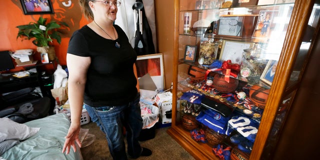 Tamara Bloemendaal talks about the death of her son, Senquez Jackson, in Cedar Rapids, Iowa, on June 21, 2016. The 15-year old was killed earlier in the year when a gun a friend was playing with accidentally discharged. Jolted awake by her older son, she recalls helping Senquez out of the recliner and watching him collapse on the floor in a pool of blood. She rode in the ambulance with the boy she called âChunksâ as a baby. Within hours, he was dead. (AP Photo/Charlie Neibergall)