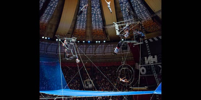 Friday, March 1, 2013: In this photo provided by The Great Moscow State Circus on Thursday, March 14, 2013, a group of acrobats, one of them, Karo Christopher Kazungu performs during a premiere show at The Great Moscow State Circus in Moscow. The Great Moscow State Circus said Kazungu fell through a safety net during a show Wednesday night and was rushed to a hospital with severe injuries including a fractured vertebra.