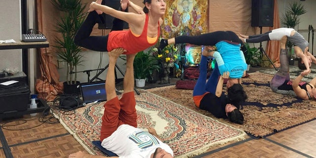 Trust is a key component in AcroYoga, as with this bow pose which had me high off the ground.