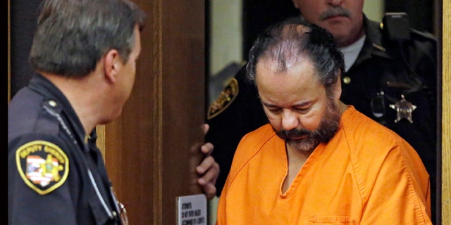 Ariel Castro is led into Cuyahoga County Common Pleas Court in Cleveland for a pretrial hearing on July 3, 2013.