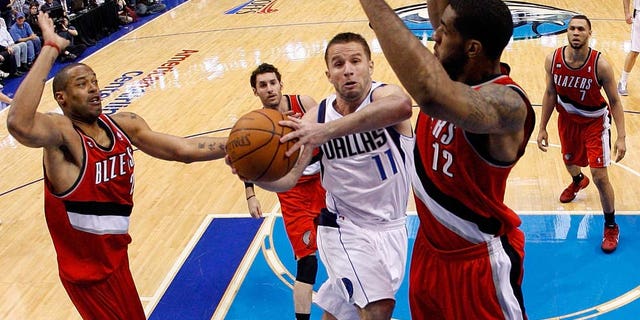 DALLAS, TX - APRIL 19: Guard Jose Juan Barea #11 of the Dallas Mavericks takes a shot against LaMarcus Aldridge #12 of the Portland Trail Blazers in Game Two of the Western Conference Quarterfinals during the 2011 NBA Playoffs on April 19, 2011 at American Airlines Center in Dallas, Texas. NOTE TO USER: User expressly acknowledges and agrees that, by downloading and or using this photograph, User is consenting to the terms and conditions of the Getty Images License Agreement. (Photo by Ronald Martinez/Getty Images)