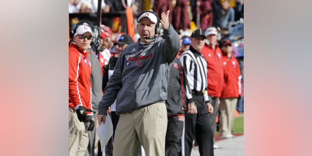 Nebraska head coach Bo Pelini disagrees with a call during the fourth quarter of an NCAA college football game against Minnesota in Minneapolis Saturday, Oct. 26, 2013. Minnesota beat Nebraska 34-23. (AP Photo/Ann Heisenfelt)