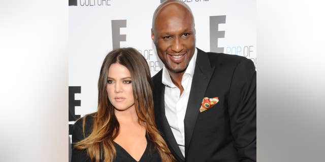 FILE - In this April 30, 2012, file photo, Khloe Kardashian Odom and Lamar Odom from the show "Keeping Up With The Kardashians" attend an E! Network upfront in New York.