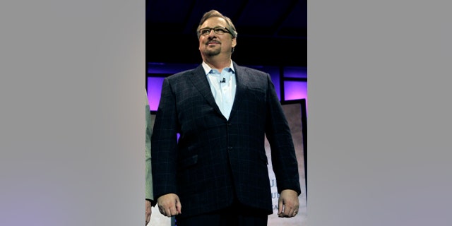 FILE - In this Nov. 29, 2010, file photo, Pastor Rick Warren acknowledges audience members during the Saddleback Civil Forum on Leadership and Service in Lake Forest, Calif. Saddleback Valley Community Church said in a statement Saturday, April 6, 2013, that Warren's 27-year-old son, Matthew Warren, has committed suicide after struggling with mental illness and deep depression. (AP Photo/Jae C. Hong, File)