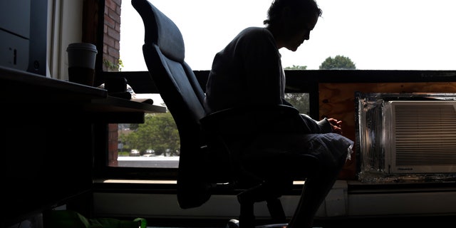 FILE- In this July 10, 2015, file photo a woman speaks to The Associated Press inside the police station in Gloucester, Mass. The woman voluntarily came to the police for help kicking her heroin addiction. A novel drug addiction program developed in the small Massachusetts fishing town, and since replicated in dozens of cities nationwide, was able to place almost 400 addicts into treatment nearly each time they sought it during the first year of operation, researchers say in a report being published Thursday, Dec. 22, 2016, in the New England Journal of Medicine. (AP Photo/Elise Amendola, File)
