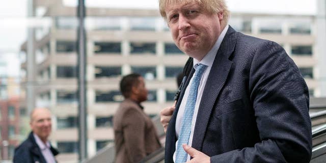 Boris Johnson arrives at Reading railway station for a day of campaigning as part of the Vote Leave EU referendum campaign, in Reading, England, Monday June 13, 2016. Polls suggest the June 23 vote on whether to leave the 28-nation bloc could go either way. (Stefan Rousseau/PA Photo via AP) UNITED KINGDOM OUT