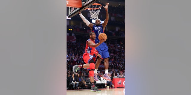 West Team's Chris Paul of the Los Angeles Clippers shoots against East Team's LeBron James of the Miamia Heat during the first half of the NBA All-Star basketball game Sunday, Feb. 17, 2013, in Houston. (AP Photo/Eric Gay)