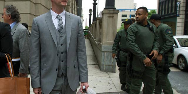 Officer Edward M. Nero one of six Baltimore city police officers charged in connection to the death of Freddie Gray, walks outside of the courthouse on a lunch break during the beginning of his trial, Thursday, May 12, 2016, in Baltimore. (AP Photo/Jose Luis Magana)