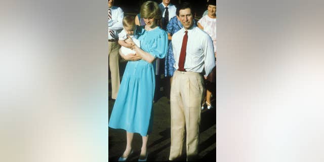 Prince Charles and Princess Diana arrive with Prince William in Alice Springs, Australia.