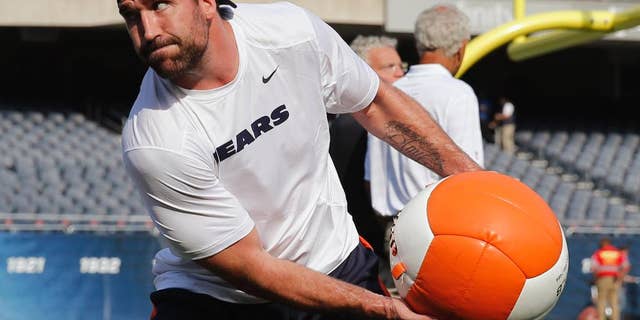 Chicago Bears defensive end Jared Allen warms up before an NFL preseason football game against the Philadelphia Eagles Friday, Aug. 8, 2014, in Chicago. (AP Photo/Charles Rex Arbogast)