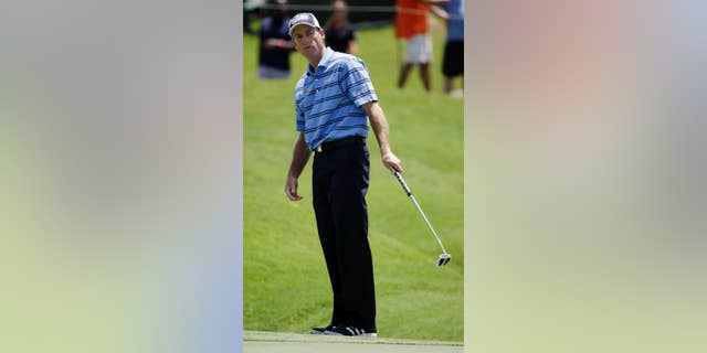 Jim Furyk reacts after missing a par putt on the ninth hole during the second round of The Players championship golf tournament at TPC Sawgrass, Friday, May 9, 2014, in Ponte Vedra Beach, Fla. (AP Photo/John Raoux)
