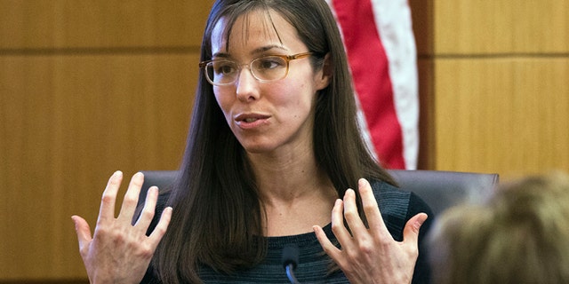 FILE - This March 5, 2013 file photo shows Jodi Arias gesturing toward the jury, in Maricopa County Superior Court in Phoenix. Arias is on trial for the murder of Travis Alexander in 2008. Arias lied repeatedly throughout her evaluation conducted by a psychologist hired by the defense, who diagnosed her with amnesia and post-traumatic stress disorder, but most of the falsities were irrelevant to his ultimate conclusions about her mental state, the psychologist testified Tuesday March 19, 2013, at Arias' murder trial.(AP Photo/The Arizona Republic,Tom Tingle, Pool, file)