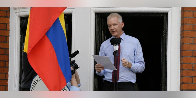 Julian Assange, founder of WikiLeaks makes a statement from a balcony of the Equador Embassy in London, Sunday, Aug. 19, 2012. Assange called on United States President Barack Obama to end a "witch hunt" against the secret-spilling WikiLeaks organization.(AP Photo/Kirsty Wigglesworth)