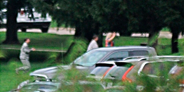 The Dayton Daily News reported that individuals were seen leaving the building with their hands in the air.