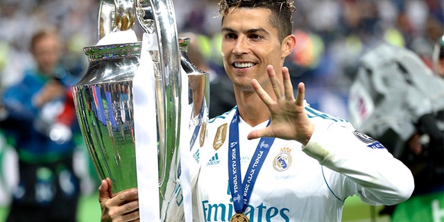 Real Madrid's Cristiano Ronaldo celebrates after winning the 2018 Champions League Final soccer match between Real Madrid and Liverpool at the Olimpiyskiy Stadium in Kiev, Ukraine. The club announced Tuesday that he is departing Real Madrid to join Italy's Juventus.