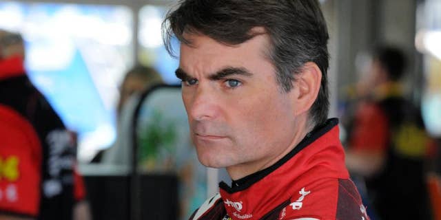 Jeff Gordon looks from the garage before practice for Sunday's NASCAR Coca-Cola 600 Sprint Cup series auto race at Charlotte Motor Speedway in Concord, N.C., Saturday, May 23, 2015. (AP Photo/Mike McCarn)