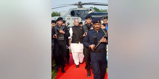 Indian Home Minister Rajnath Singh arrives to lay the foundation stone for the Central Forensic Science Laboratory on the outskirts of Gauhati, in the northeastern Indian state of Assam, Saturday, Nov. 29, 2014. Singh, the second-most powerful official in India after Prime Minister Narendra Modi, hit out at Pakistan on Saturday, accusing its state agencies of using terror to try to destabilize India, and rejecting Pakistan's assertion that non-state actors are involved in terrorism. (AP Photo/Press Trust of India)
