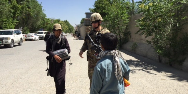 U.S troops with local Afghans in Kabul.