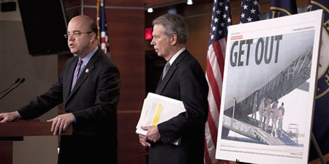 Rep. Jim McGovern, left, accompanied by Rep. Walter Jones, speak in Washington May 5, announcing their bipartisan bill calling for an exit strategy for U.S. forces from Afghanistan.