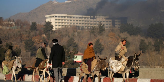Smoke rises from the Intercontinental Hotel during an attack in Kabul, Afghanistan January 21, 2018.