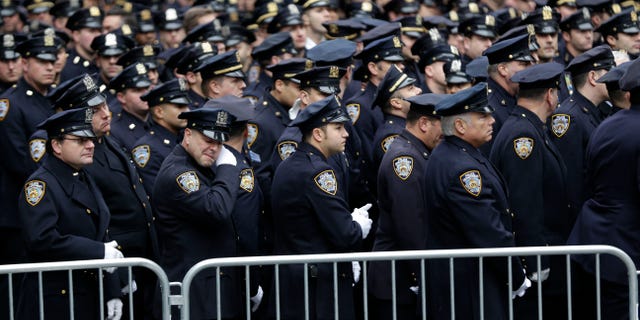 Police officers went to St. Patrick's Cathedral to pay their last respects to Joseph Lemm.