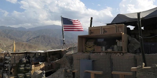 A U.S. flag is seen at a post in Deh Bala district, Nangarhar province, Afghanistan after the area was recaptured from ISIS fighters.