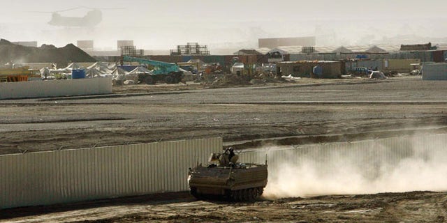 An armored vehicle patrols on the periphery of Camp Bastion in southern Afghanistan, in this Wednesday, Jan. 10, 2007 file photo.