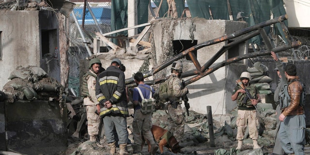 March 26, 2013: Afghan police and U.S. forces arrive to the scene after eight suicide bombers attacked a police headquarters in the eastern Afghan city of Jalalabad, Afghanistan, killing five police officers and wounding four others, a security official said. An insurgent in a bomb-laden car detonated his vehicle in front of the Jalalabad Police Quick Reaction Force to start the attack, and another seven attackers wearing bomb vests then stormed the compound.