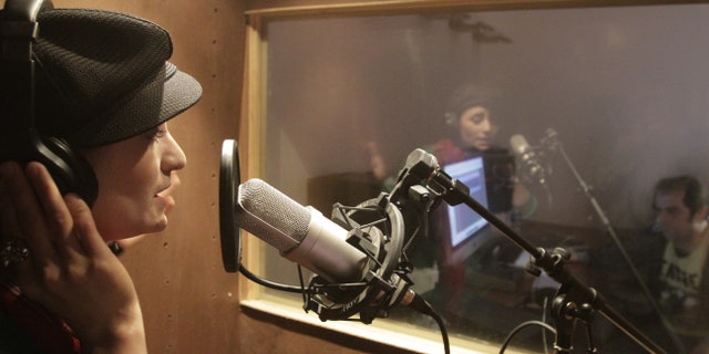Oct. 3, 2012: In this photo, Afghanistan's first female rapper Sosan Firooz sings in a studio in Kabul, Afghanistan. Firooz, 23-year-old singer is making history in her homeland where society frowns on women who take the stage.