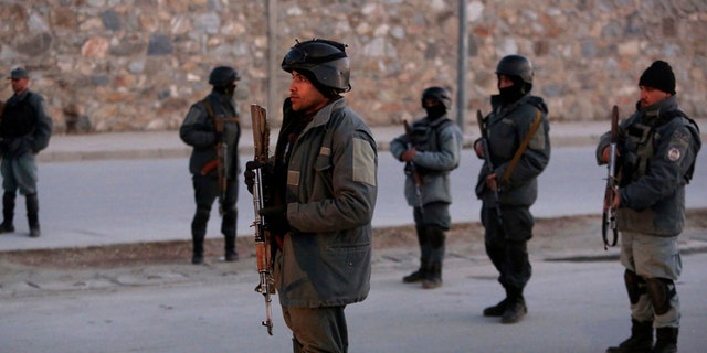 Afghan security forces inspect the site of two large bombings in Kabul, Afghanistan, Tuesday, Jan. 10, 2017. Two loud explosions have rocked the Afghan capital of Kabul, causing casualties. The target of the blasts was probably an area that includes government and lawmakers' offices. Sediq Sediqqi, spokesman for the Interior Ministry, said that first, a suicide bomber carried out an attack, followed by a second explosion, caused by car bomb parked near the site. (AP Photo/Rahmat Gul)