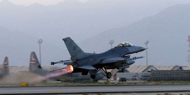 A U.S. Air Force F-16 Fighting Falcon aircraft takes off for a nighttime mission at Bagram Airfield, Afghanistan.