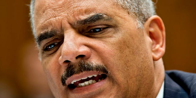 May 15, 2014: Attorney General Eric Holder reacts to aggressive questioning from Rep. Darrell Issa, R-Calif. as he testifies on Capitol Hill in Washington. (AP)