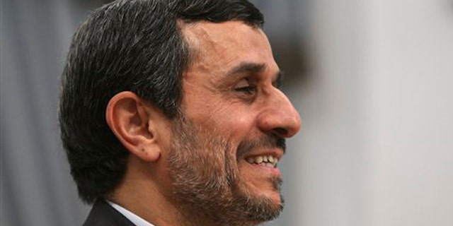 Dec. 13, 2011: Iranian President Mahmoud Ahmadinejad, smiles, prior to a meeting at the presidency office in Tehran, Iran.