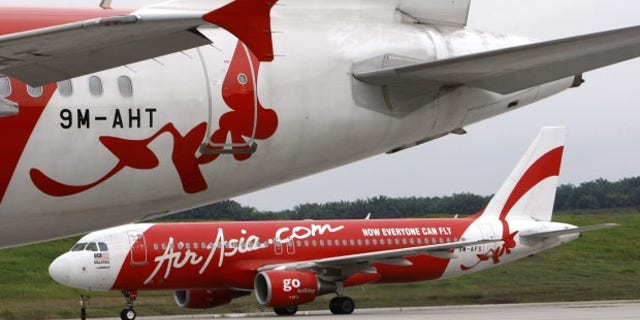AirAsia planes lineup on a runway (AP/File)