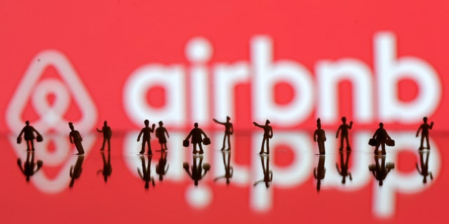 File photo: A 3D printed people's models are seen in front of a displayed Airbnb logo in this illustration taken, June 8, 2016. (REUTERS/Dado Ruvic)