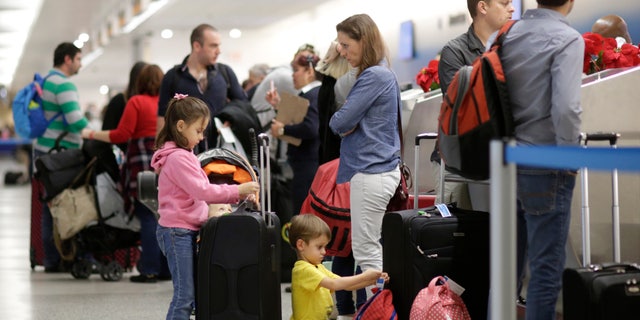 Travelers in Miami International Airport