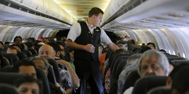 Crowded conditions: Airline carriers pack more passengers on each flight to save money.