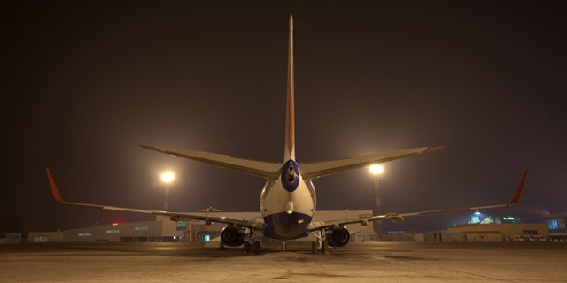 big air jet on ground at night