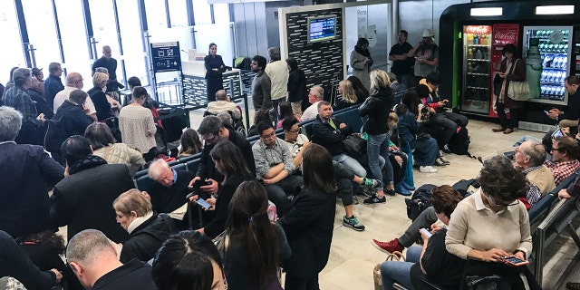 Police had to be called in to help calm irate passengers who say their Allegiant Air Flight "strung them along" during a 14-hour delay.