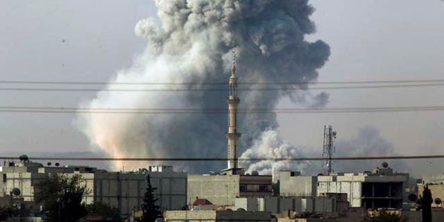 Oct. 14, 2014: Smoke rises following an airstrike by the U.S.-led coalition in Kobani, Syria as fighting continues between Syrian Kurds and the militants of Islamic State group, as seen from Mursitpinar, on the outskirts of Suruc, at the Turkey-Syria border. Kobani, also known as Ayn Arab, and its surrounding areas, has been under assault by extremists of the Islamic State group since mid-September and is being defended by Kurdish fighters.